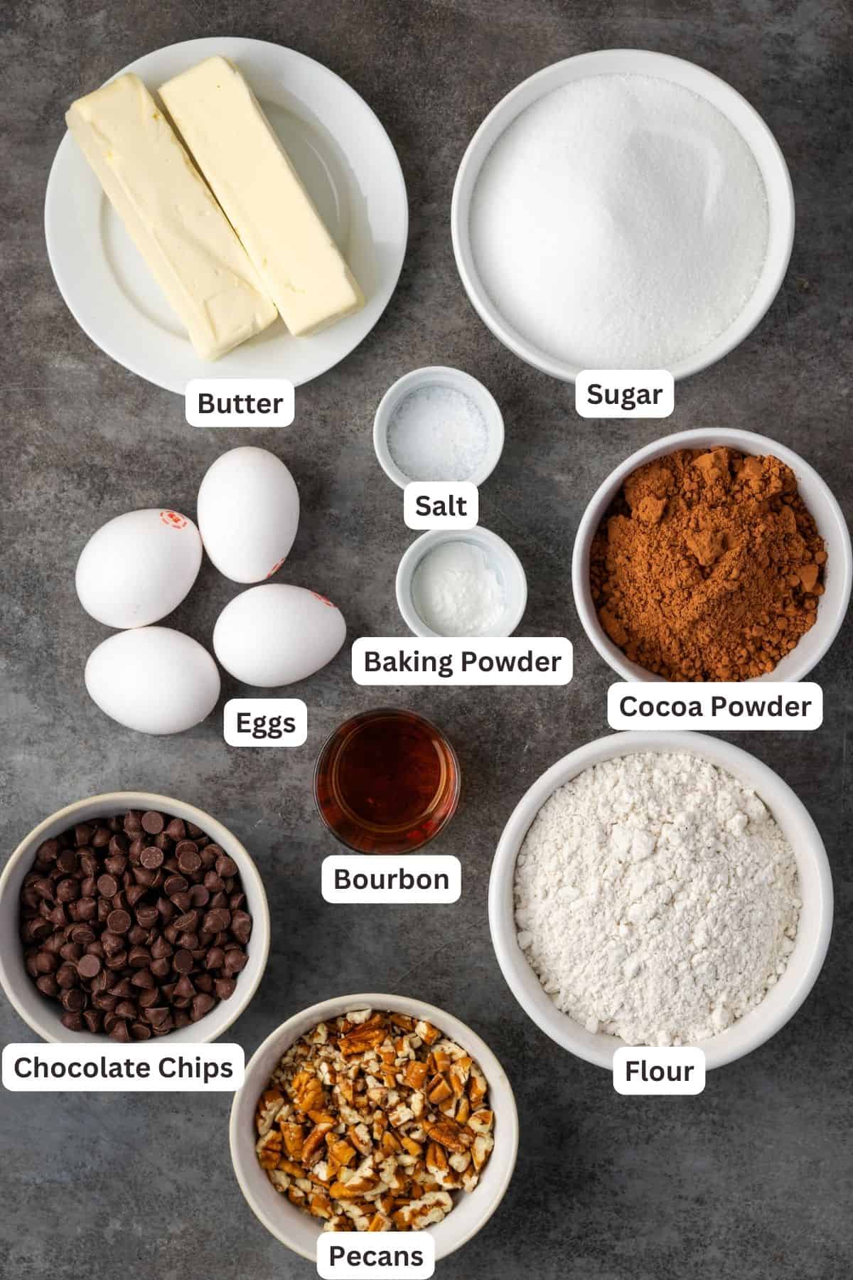 Ingredients for bourbon pecan brownies with text labels overlaying each ingredient.