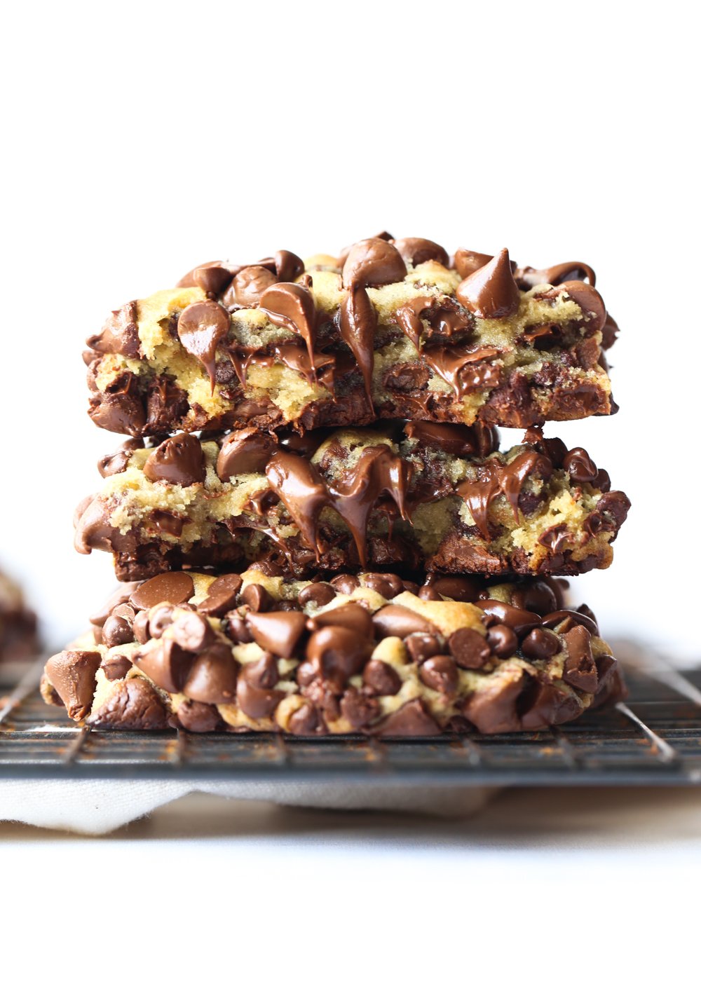 3 cookies stacked with melted chocolate