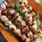 Chicken Kabobs made with rosemary grilled on skewers.