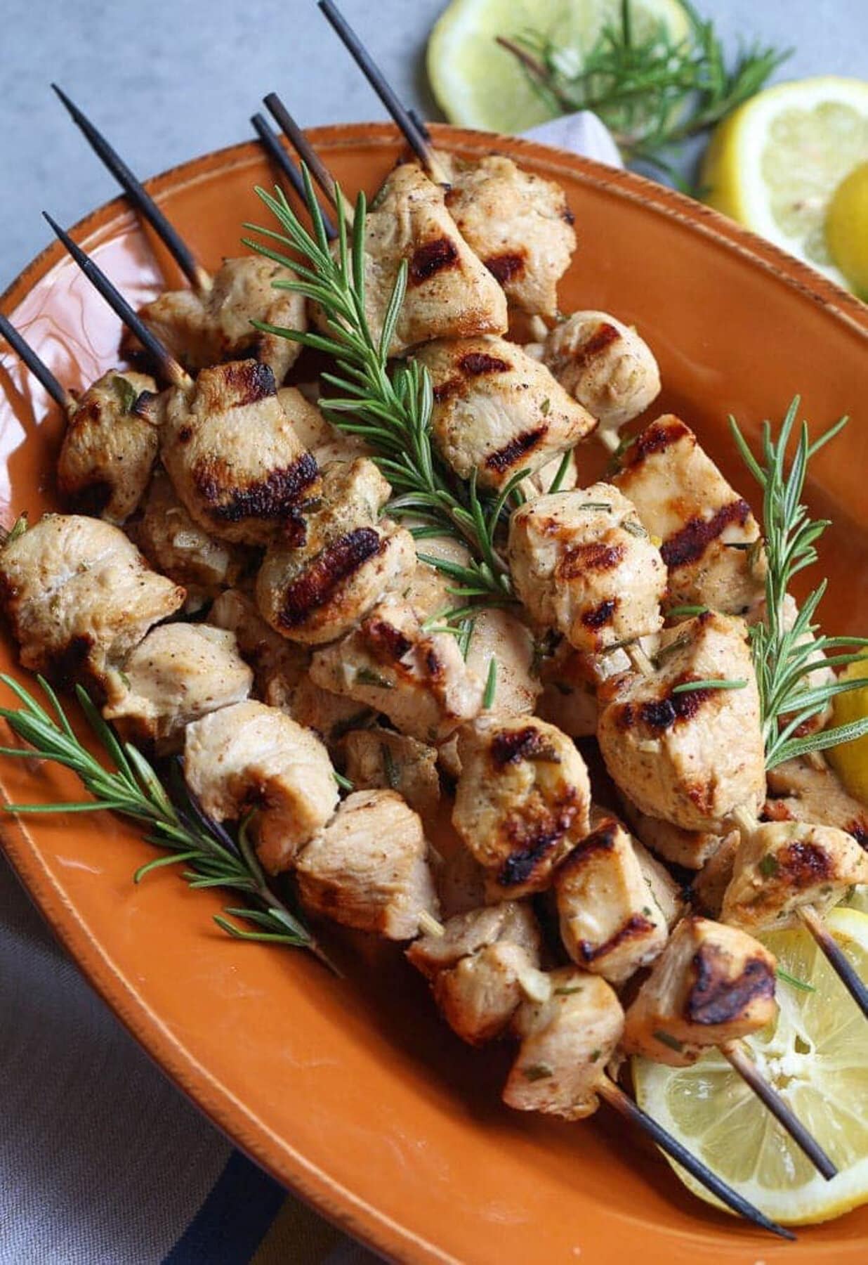 Chicken Kabobs made with rosemary grilled on skewers.