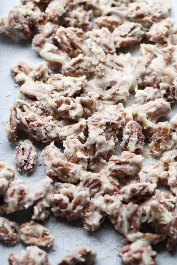 Sour Cream Pecans cooling on parchment paper