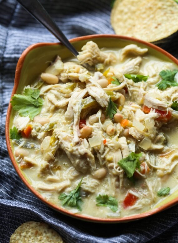 A bowl of chicken chili with cilantro