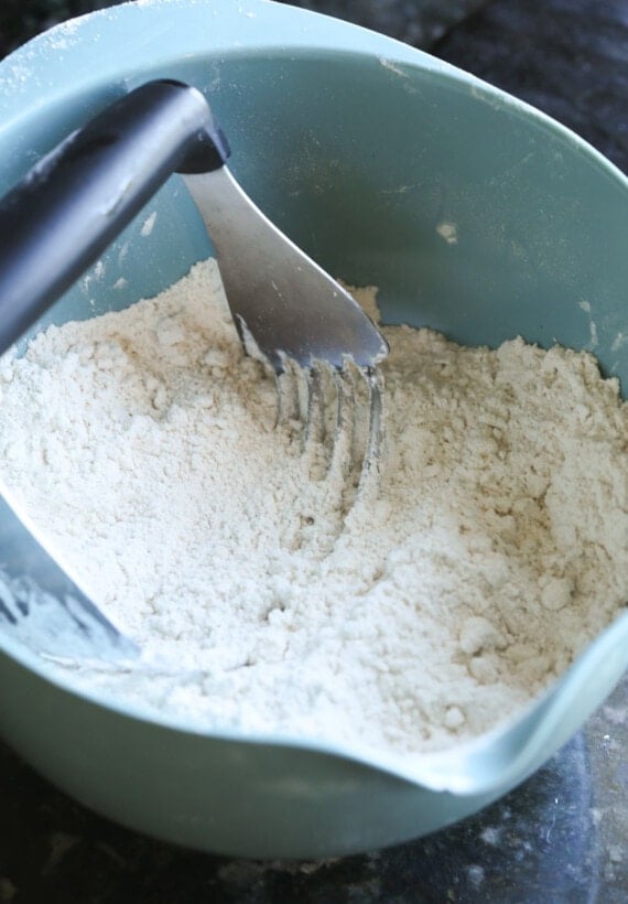 Cutting flour and yeast together to make a dough