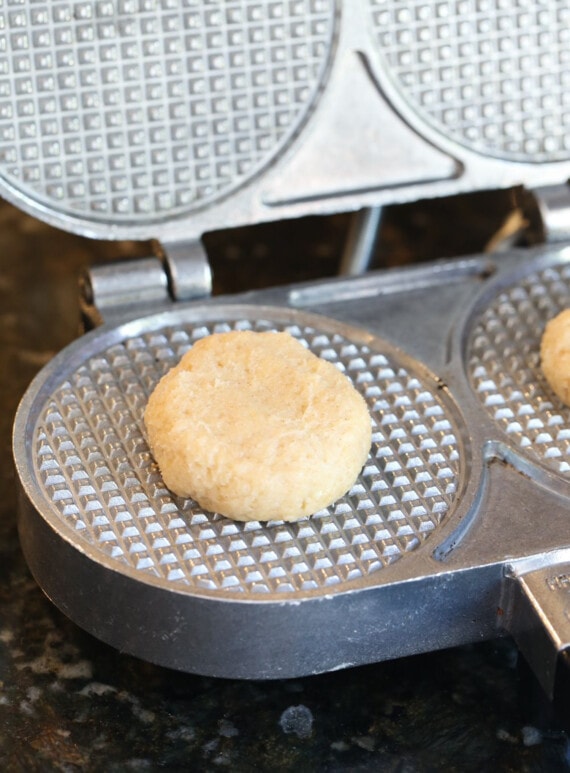 Pressing dough into a waffle press