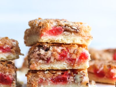 Stacked Cherry Coconut Bars with shortbread crust