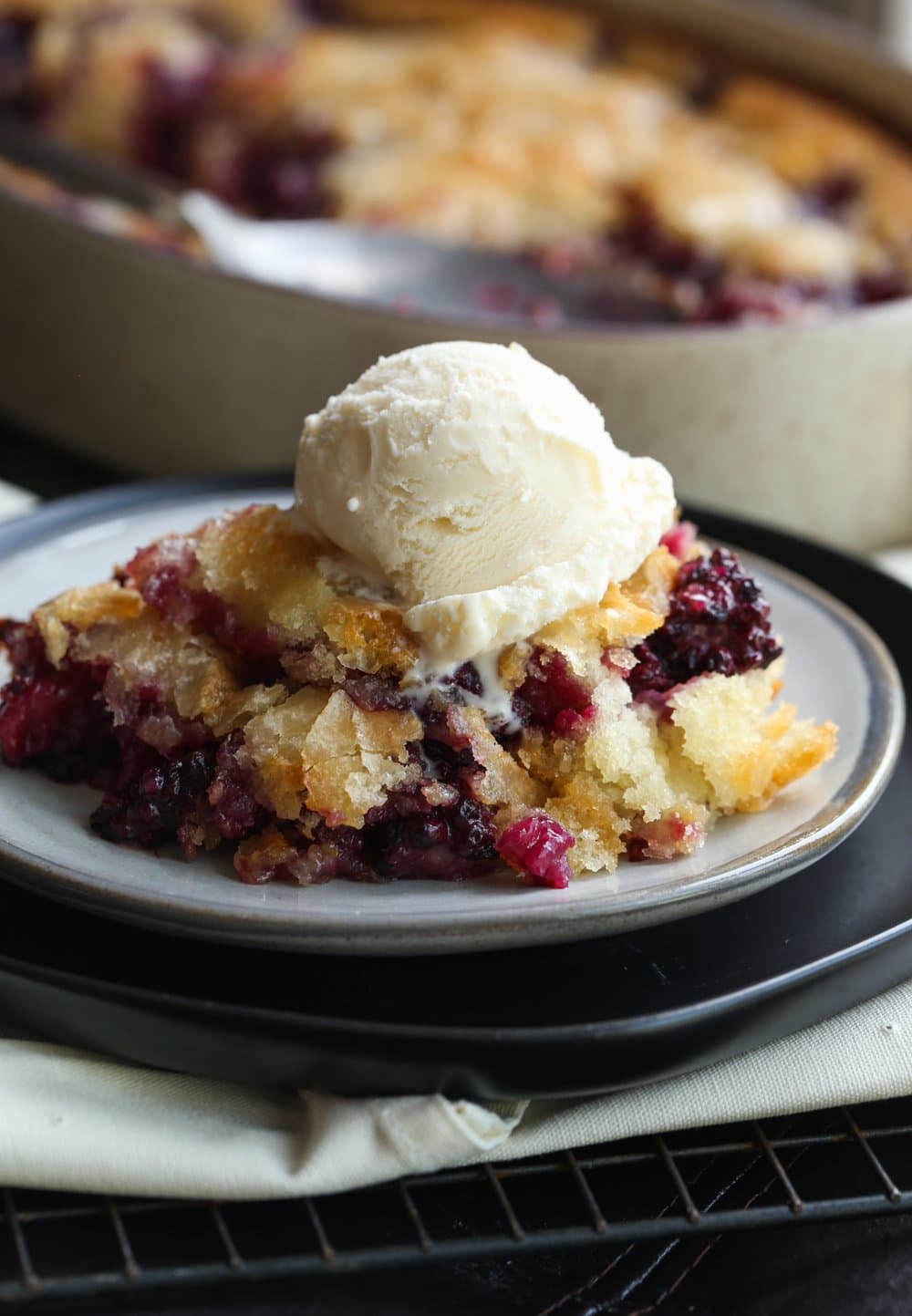 Backberry Cobbler on a plate with ice cream