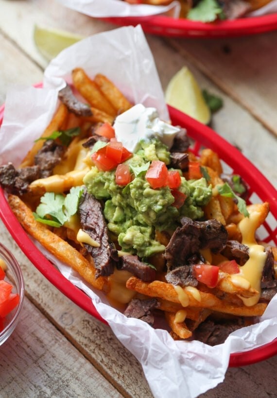 Loaded tex mex french fries with cheese, guacamole, and steak