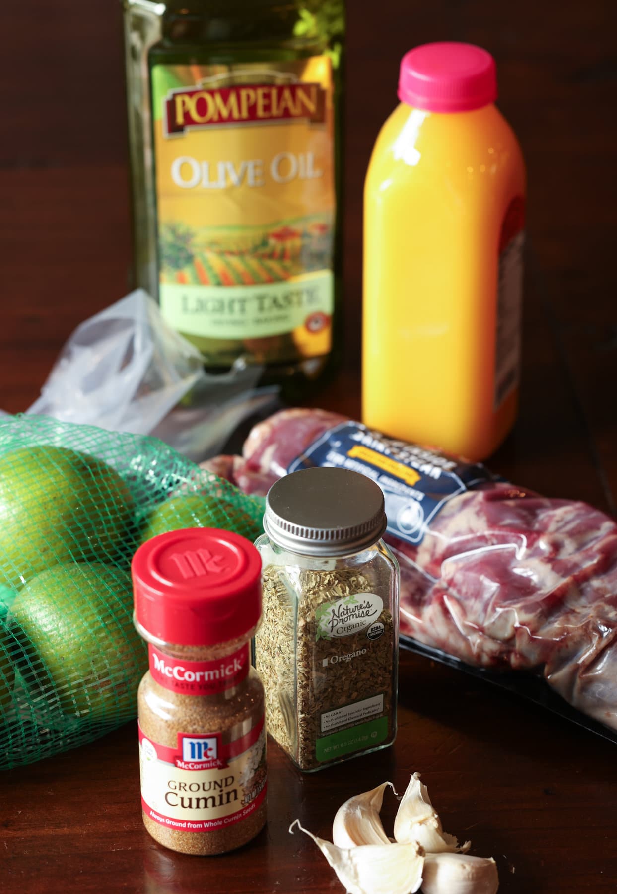 Ingredients for Crane Asada marinade: olive oil, orange juice, limes, and spices