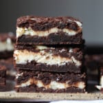 A Close-up of Three Cheesecake Stuffed Brownies From the Side