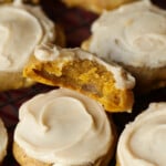 A pumpkin cookie broken in half showing the moist center