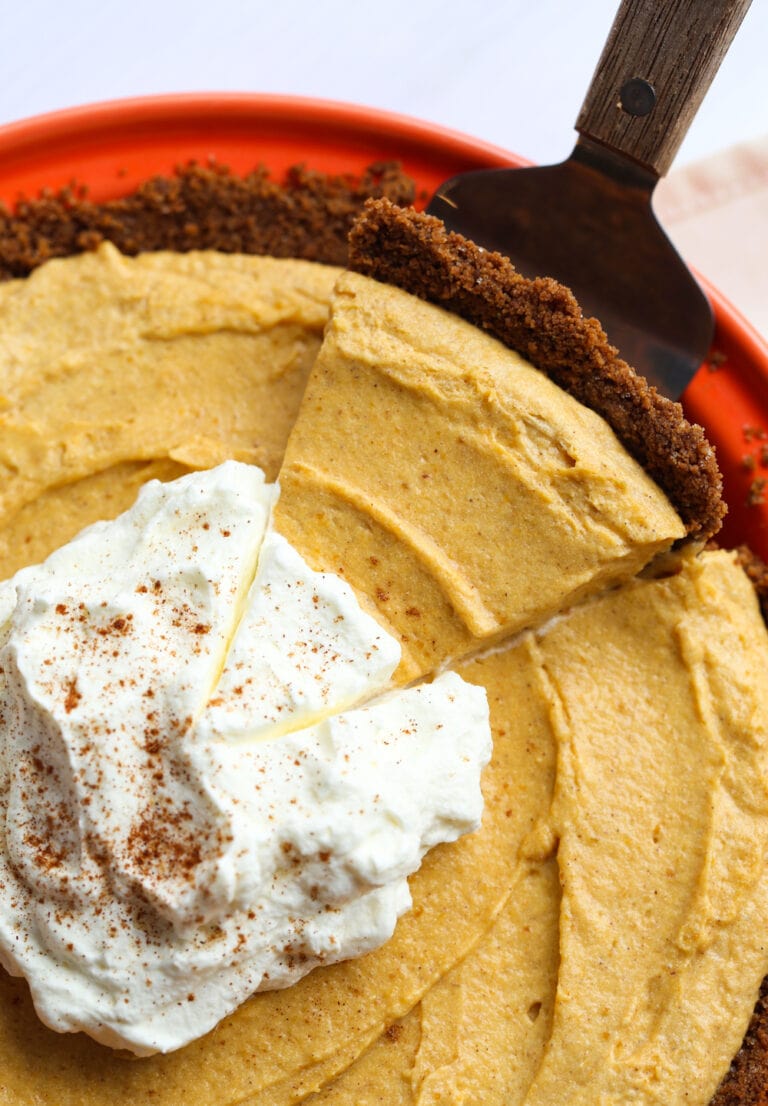 Slice of pumpkin mousse pie on dessert spatula