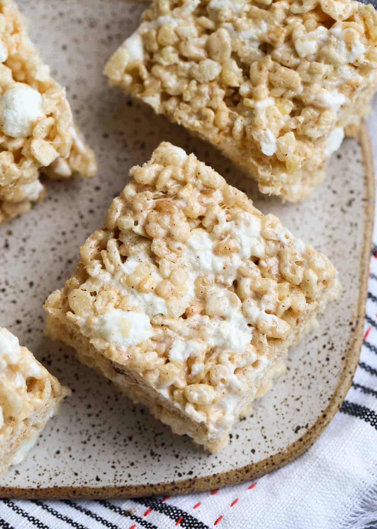 Pumpkin Spice Krispie Treats on a plate from above showing gooey marshmallow