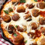 Chicken Parm meatballs in a cast iron skillet