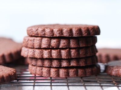 A Pile of Five Chocolate Sugar Cookies Sitting on a Cooling Rack