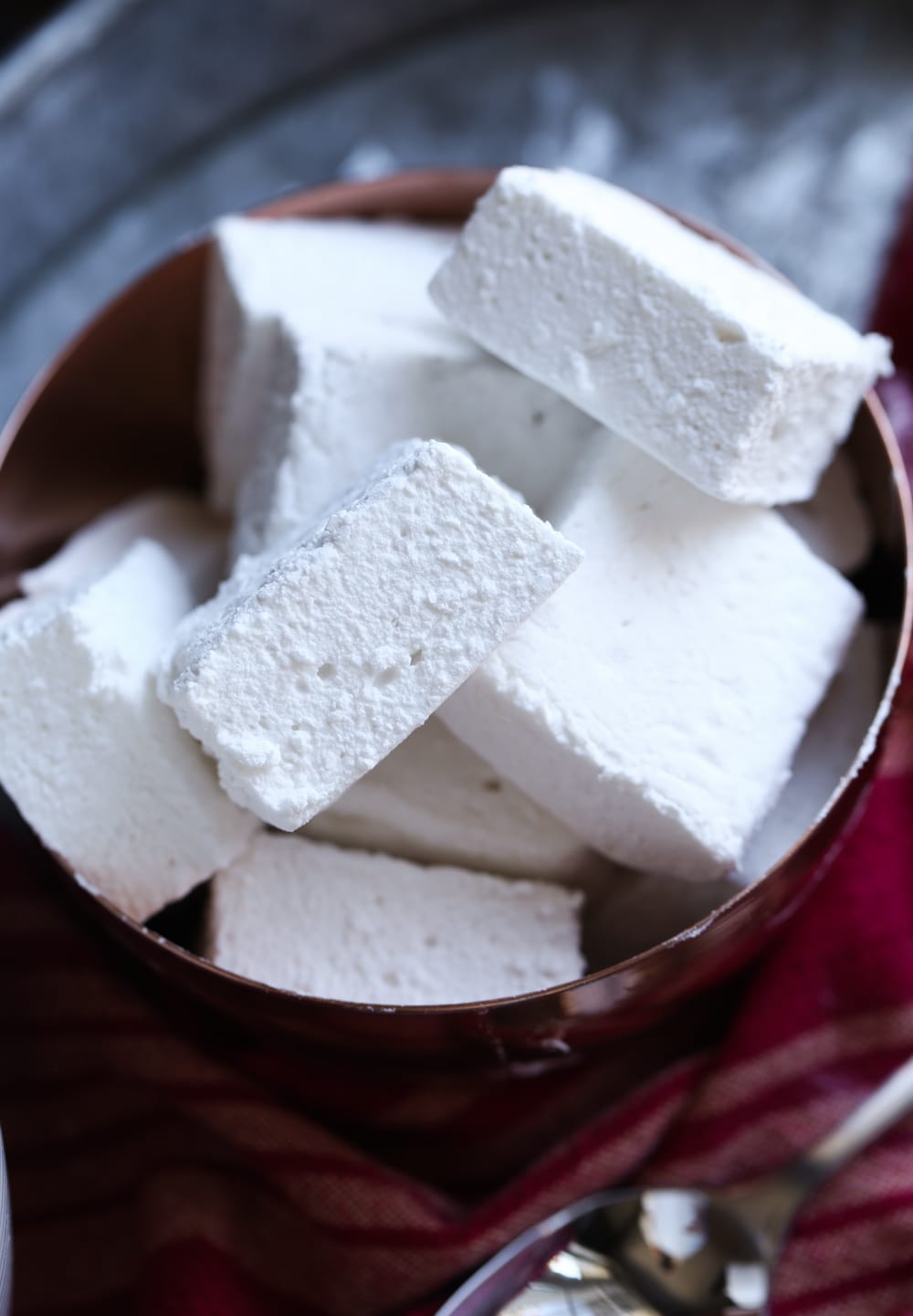 A Pile of Homemade Marshmallows in a Brown Bowl