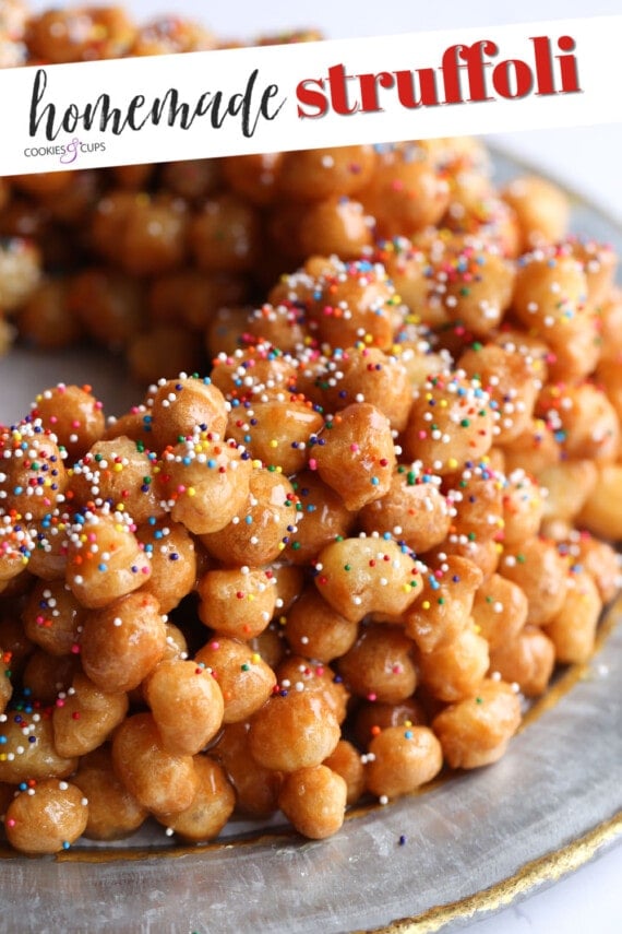 A Ring of Crispy Fried Dough Balls Coated in Honey and Garnished with Sprinkles