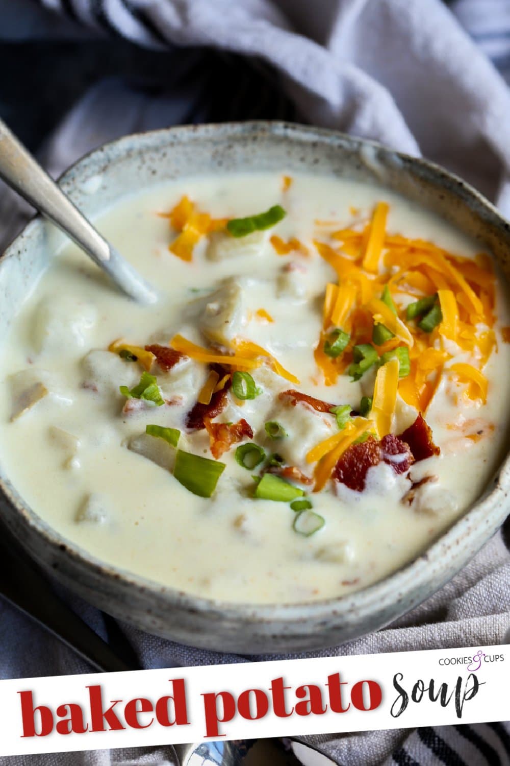Bowl of baked potato soup with bacon bits.