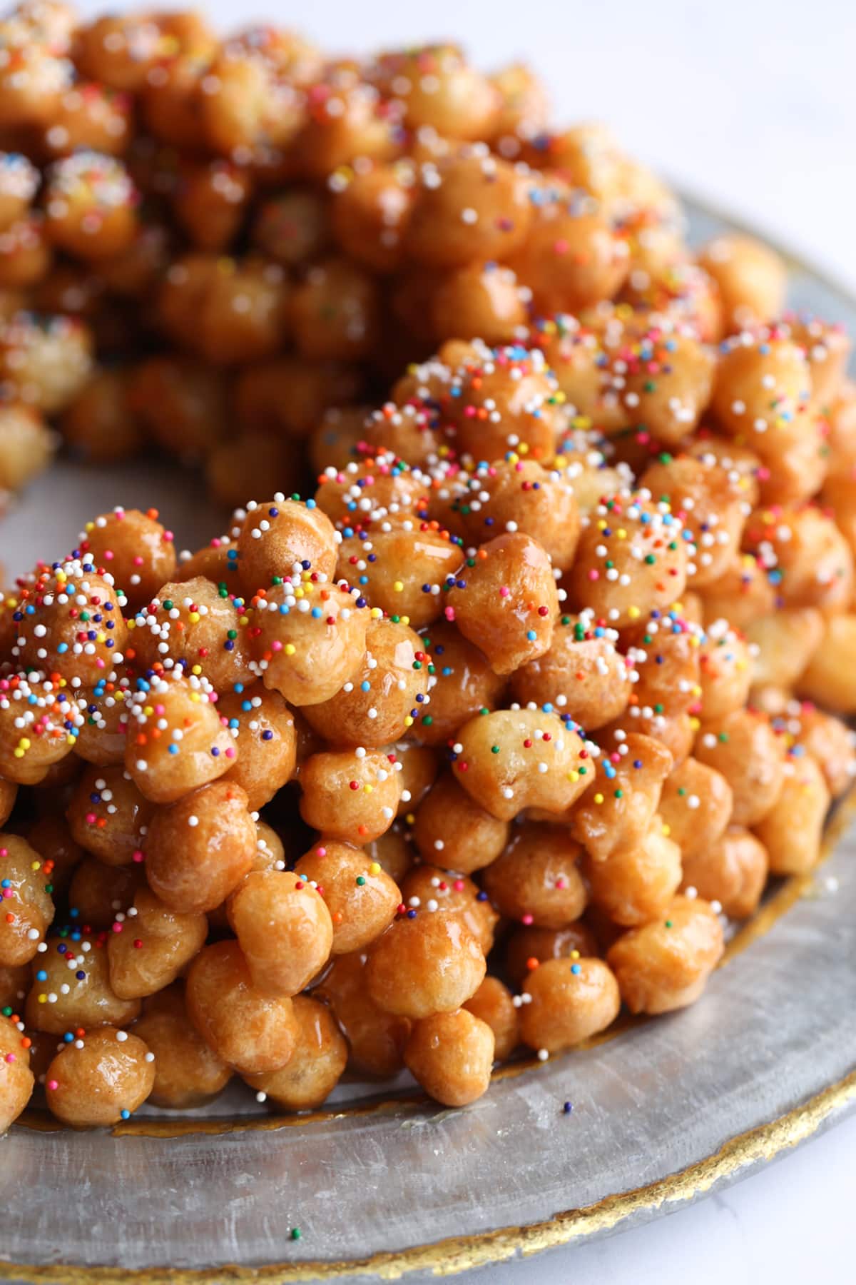 Rainbow sprinkles on top of Struffoli honey balls