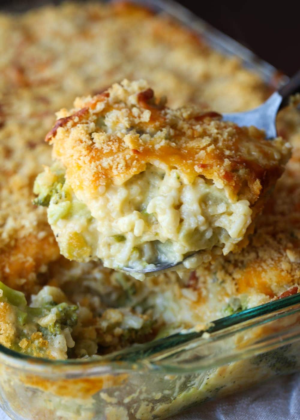 Cheesy broccoli rice casserole with crushed cracker topping.