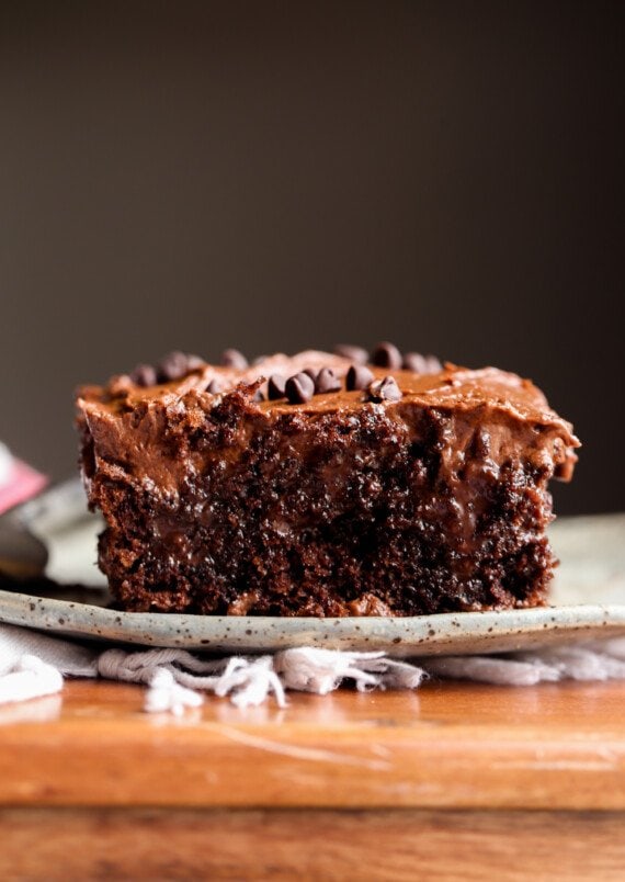 Chocolate Poke Cake sliced on a plate