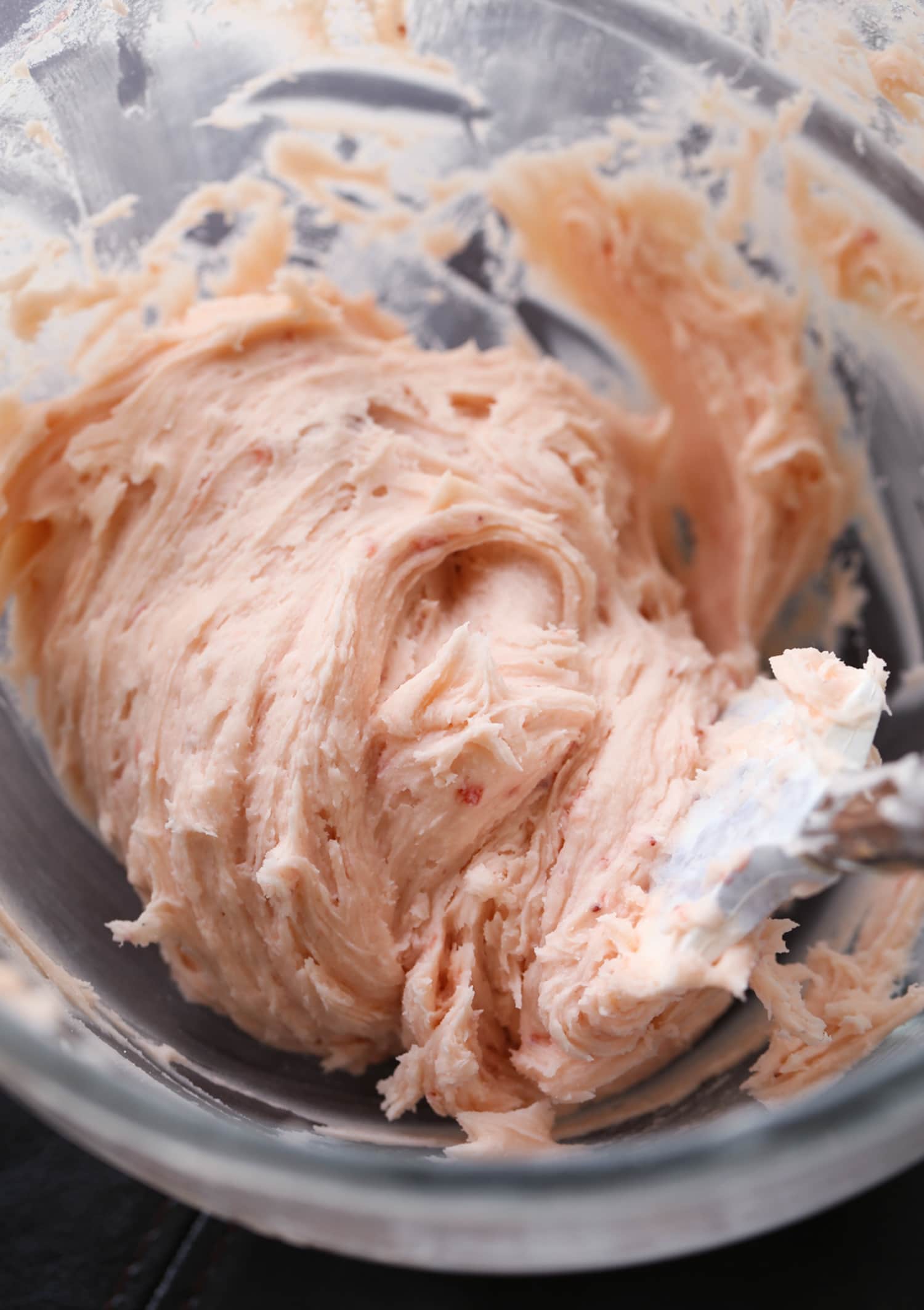 strawberry frosting in mixing bowl