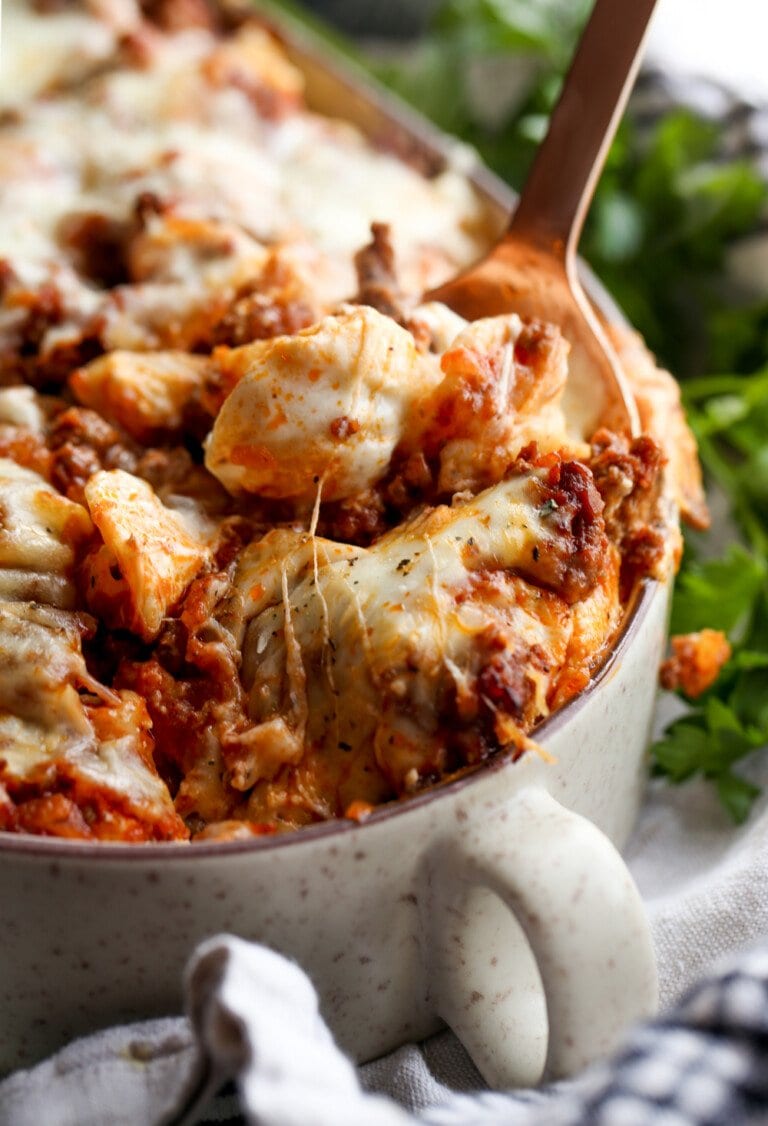 Unstuffed Shells pasta casserole with a spoon and melty cheese