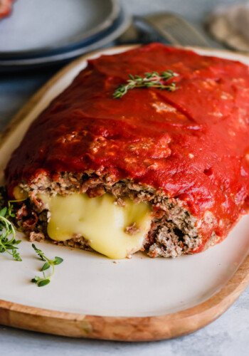 Pizza meatloaf sliced open with cheese oozing out
