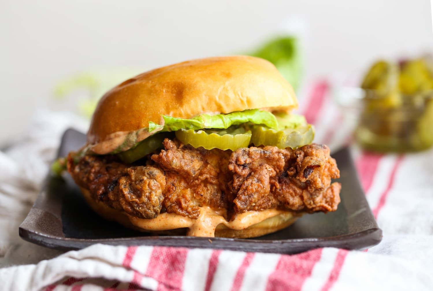 Fried chicken sandwich with pickles.
