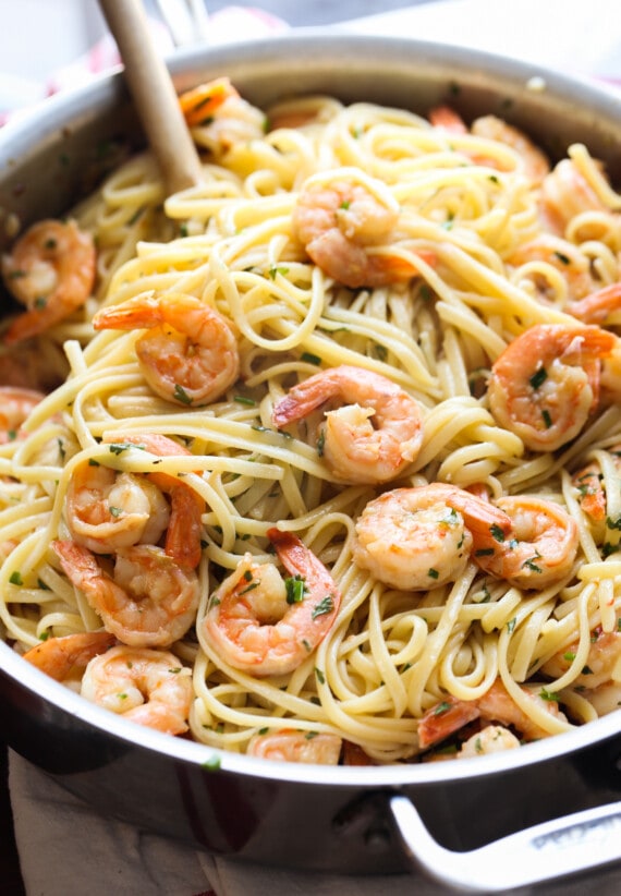 Pan full of shrimp and linguine.