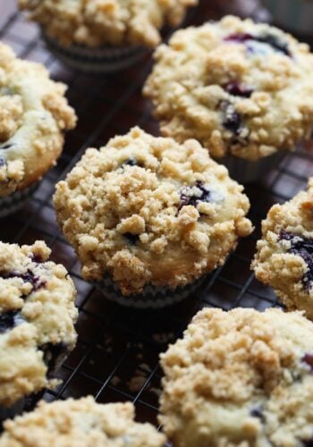 Blueberry cream cheese muffins on a cooling rack.