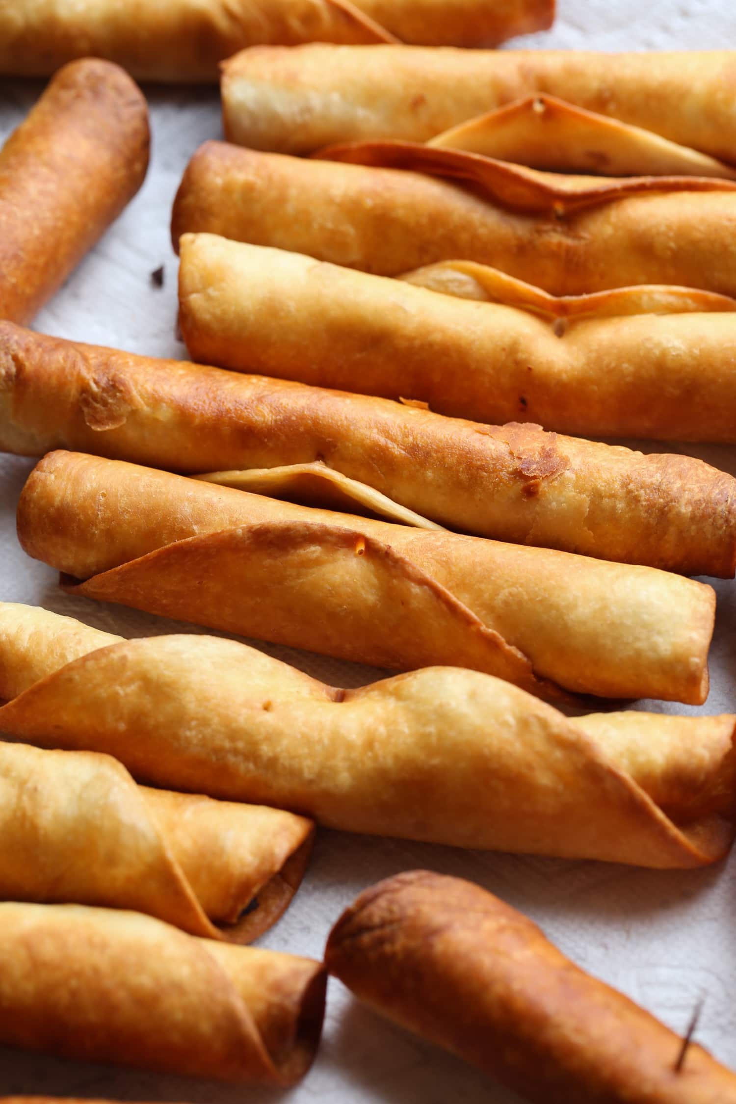 Fried Flautas on a paper towel lined baking sheet