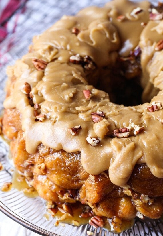 Monkey Bread baked in a bundt pan and covered in sweet brown sugar frosting