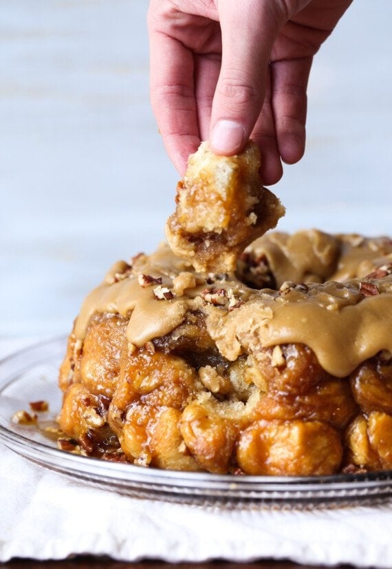 Pulling apart a piece of monkey bread