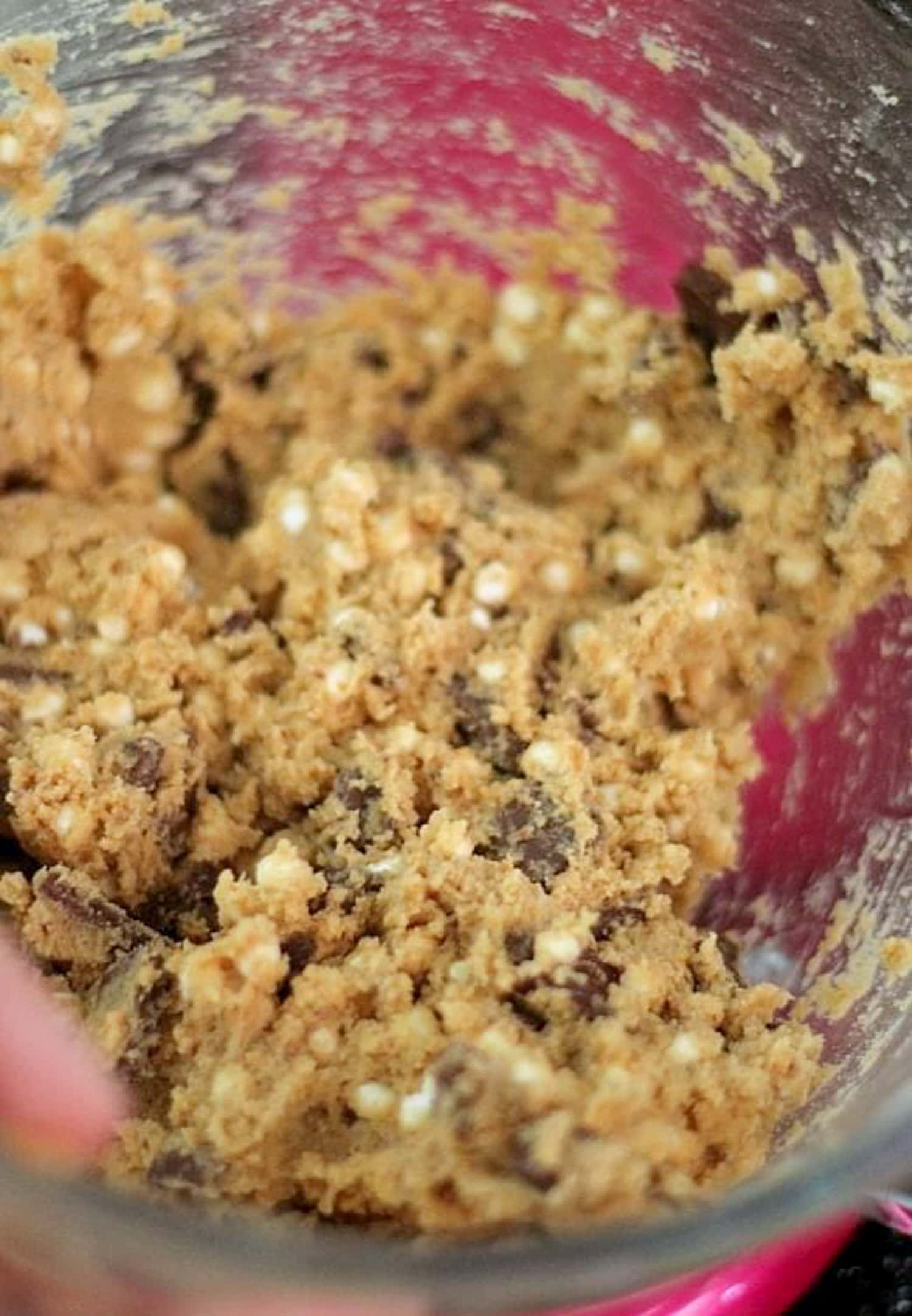 Cookie Dough for s'mores cookies recipe in a clear glass mixing bowl of a stand mixer