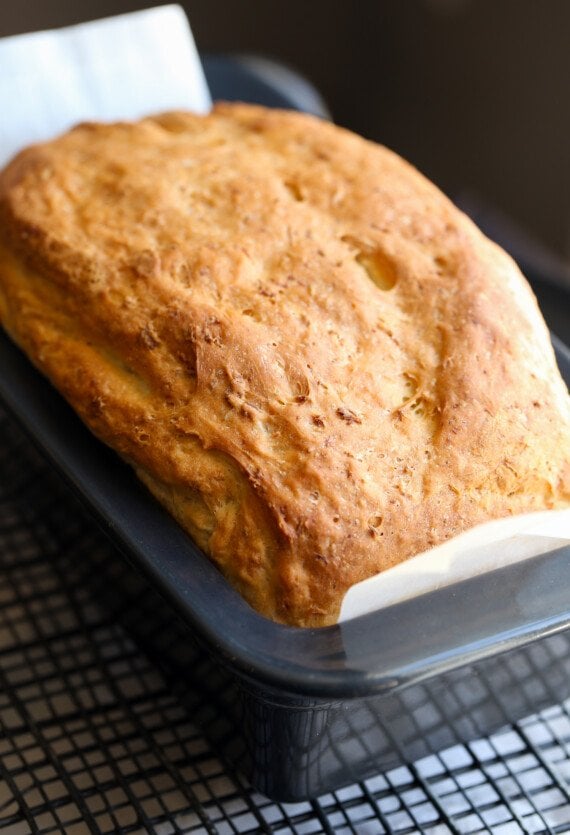 Loaf of baked honey oatmeal bread.
