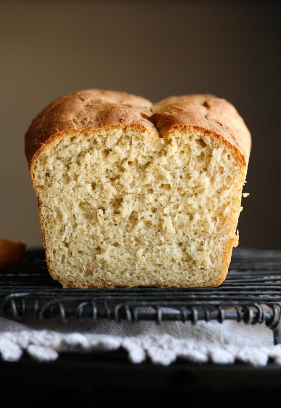 Sliced loaf of honey oatmeal bread.