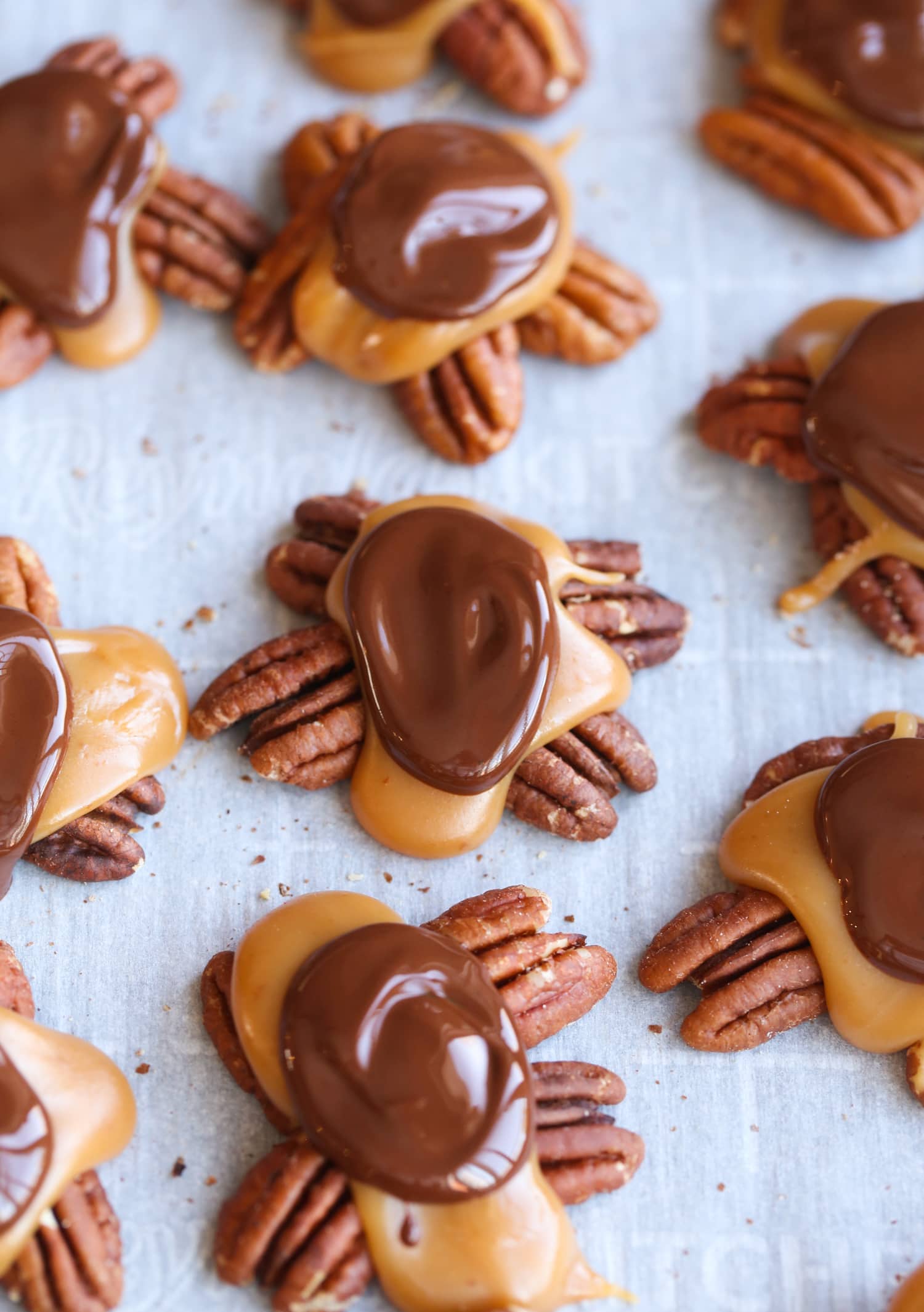 Melted chocolate on caramel pecans.