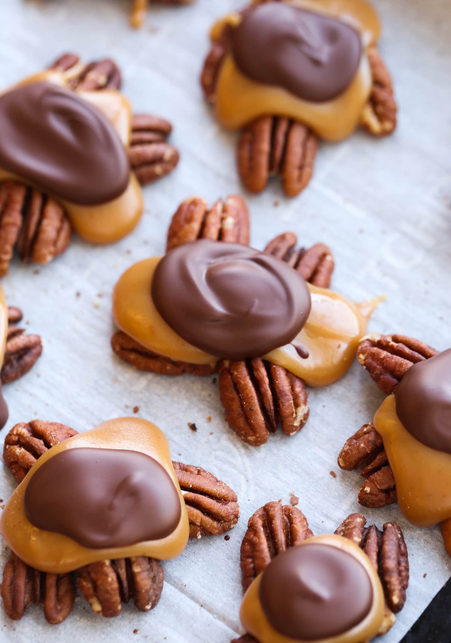 Cooled chocolate on caramel pecans.