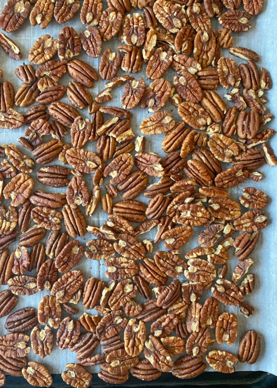 Toasted pecans on a tray.