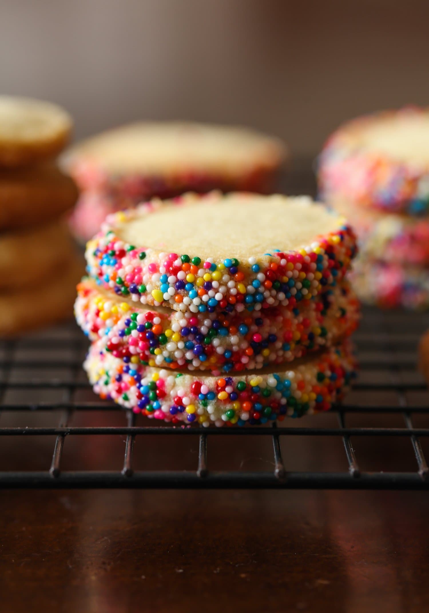 Stack of 3 butter cookies with sprinkles on the edges