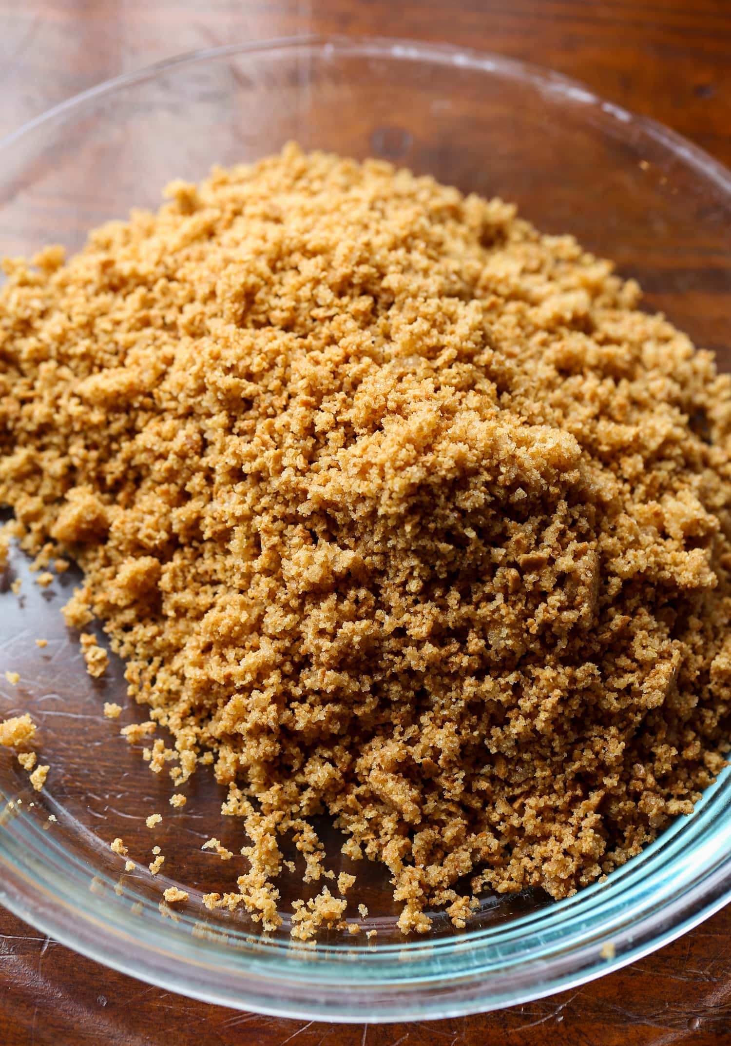 Crushed graham cracker crumbs in a plate.