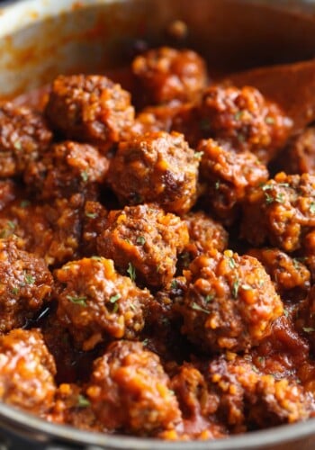 Beef meatballs packed with rice in a saucepan.