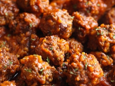 Beef meatballs packed with rice in a saucepan.