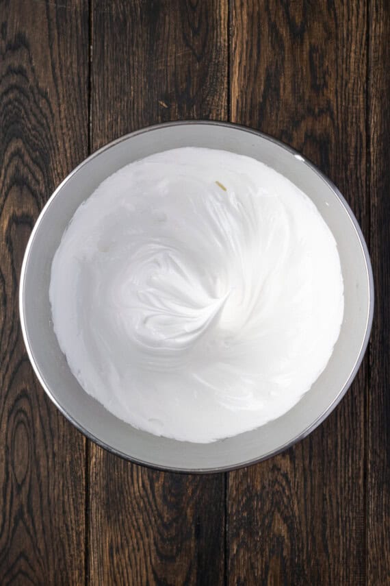 Whipped egg whites in a bowl.