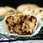 Zucchini Muffin broken in half on a cupcake liner