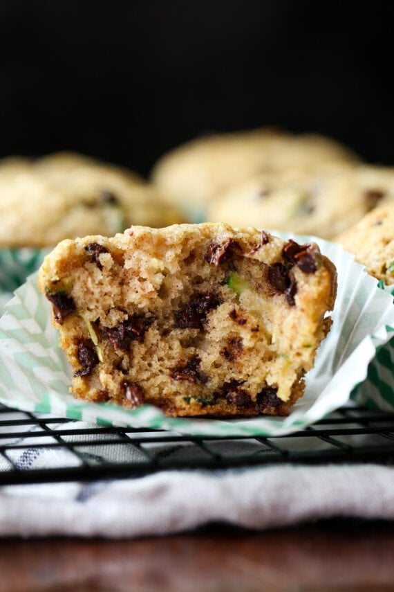 Zucchini Muffin broken in half on a cupcake liner