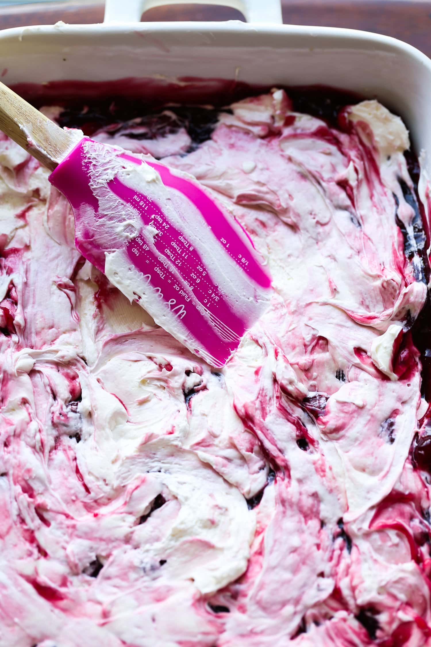 swirling cherry filling with creamy whipped topping