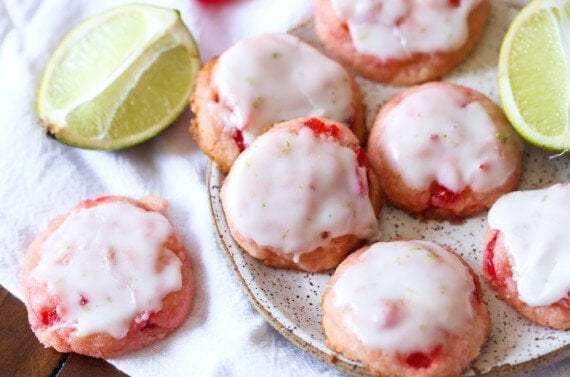 cherry cookies with lime icing on a plate