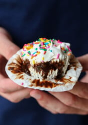 Holding an ice cream cupcake and unwrapping it