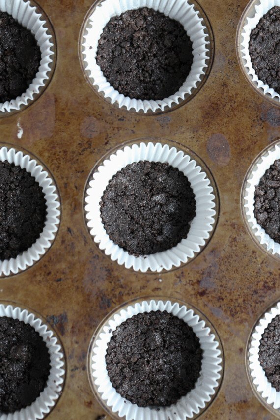 Oreo crust pressed into a cupcake liner
